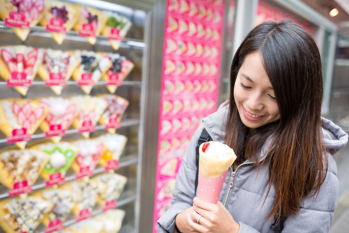 shibuya tokyo girl eating crepe