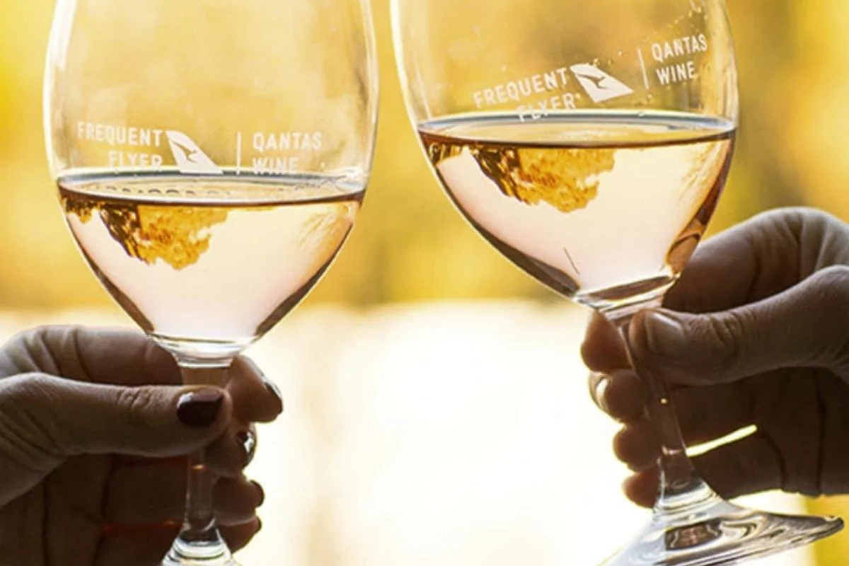 qantas wine guide glasses clinking