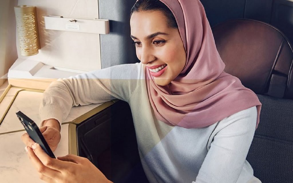 etihad guest guide lady using wifi