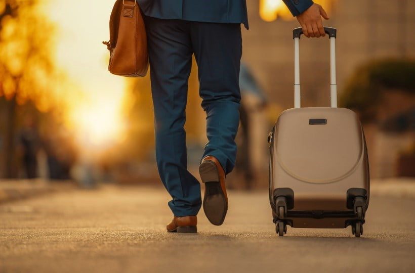 business traveller carrying hand luggage