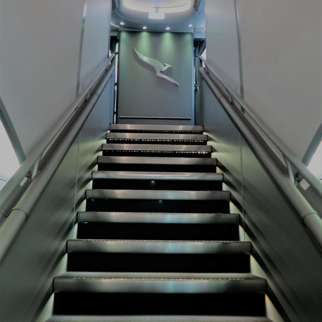 Qantas staircase to upper deck Qantas A380 first class review